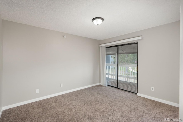 18071 E Kentucky Ave Unit 203, Aurora, CO 80017 - spare room featuring carpet, baseboards, and a textured ceiling