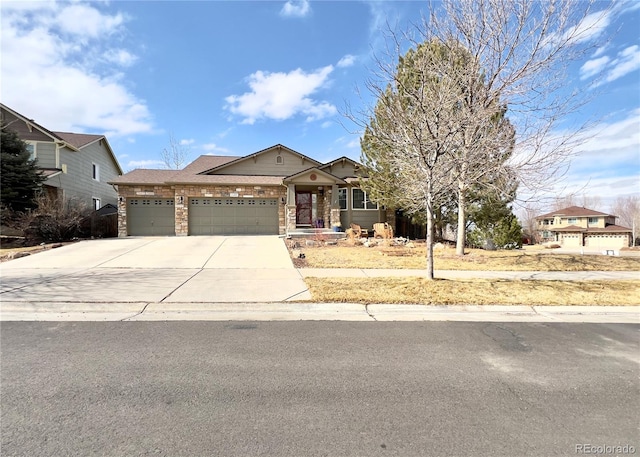 view of front of house with a garage, driveway, and brick siding