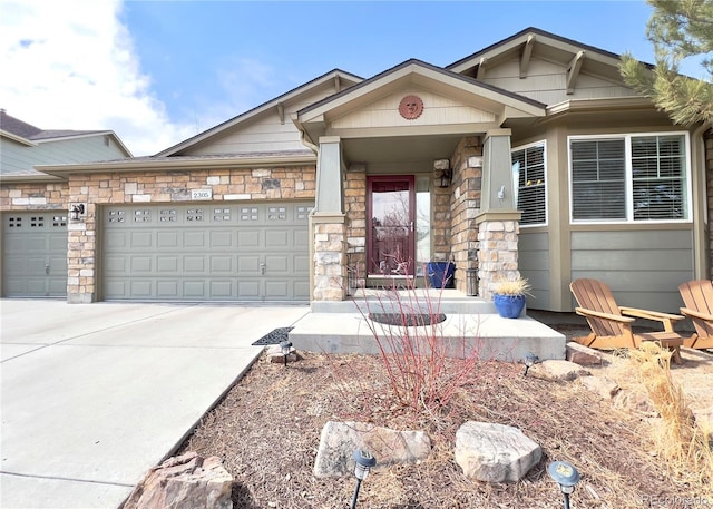 craftsman house featuring a garage, stone siding, and driveway