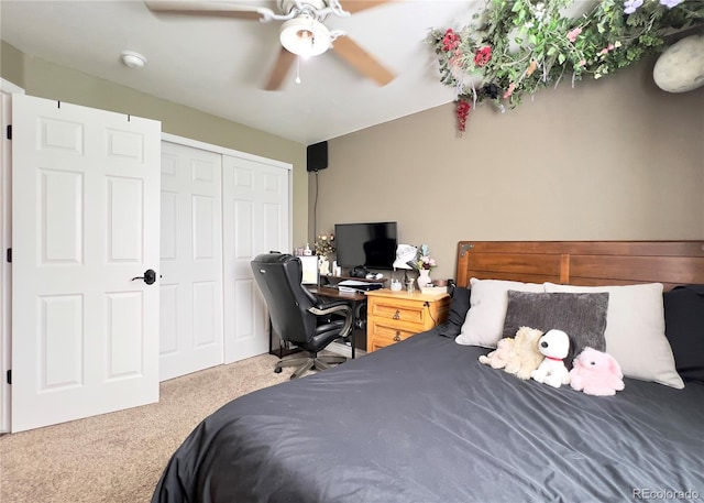 bedroom featuring carpet floors, ceiling fan, and a closet