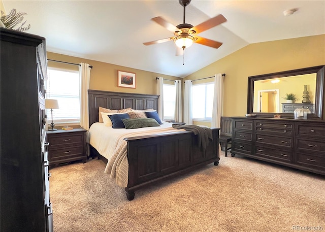 bedroom featuring lofted ceiling, ceiling fan, and light colored carpet