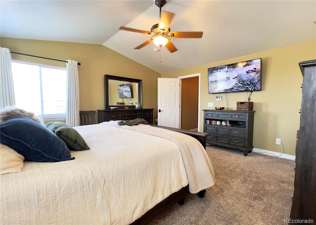 bedroom with a ceiling fan, light colored carpet, vaulted ceiling, and baseboards