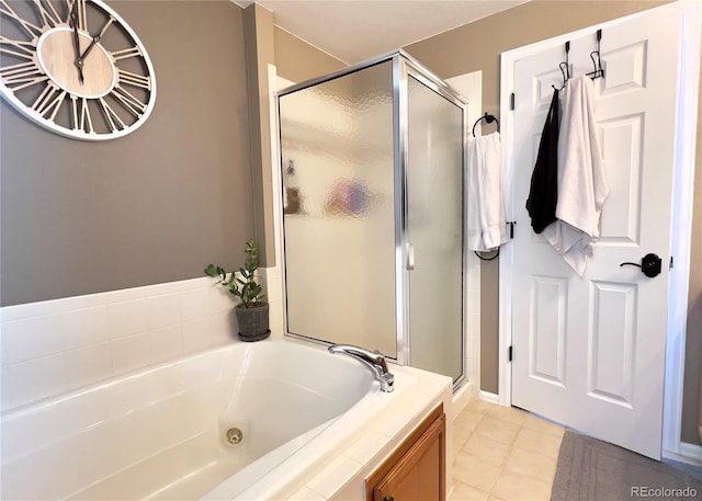 full bathroom with tile patterned floors, a shower stall, and a bath