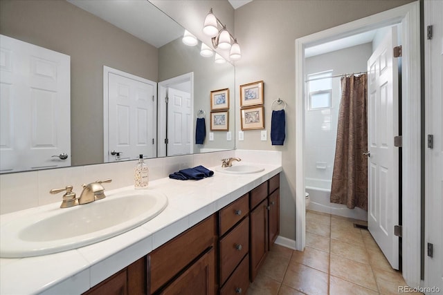 full bathroom featuring shower / tub combo with curtain, vanity, toilet, and tile patterned flooring