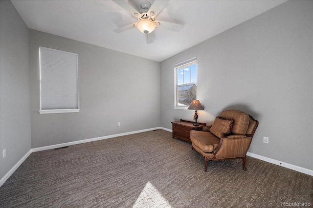 sitting room featuring ceiling fan