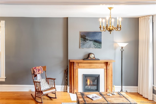 living area with a notable chandelier and wood-type flooring