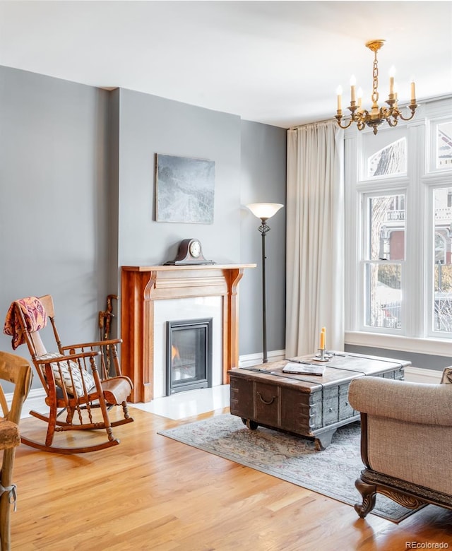 sitting room featuring hardwood / wood-style flooring and a notable chandelier