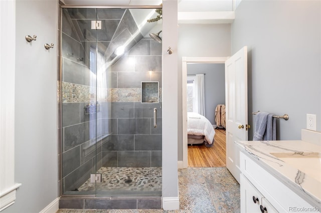 bathroom featuring vanity and an enclosed shower