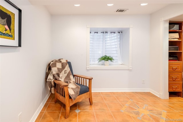 living area with light tile patterned floors