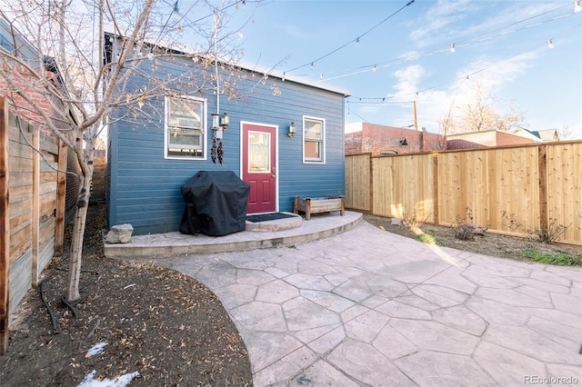 rear view of property featuring a patio area