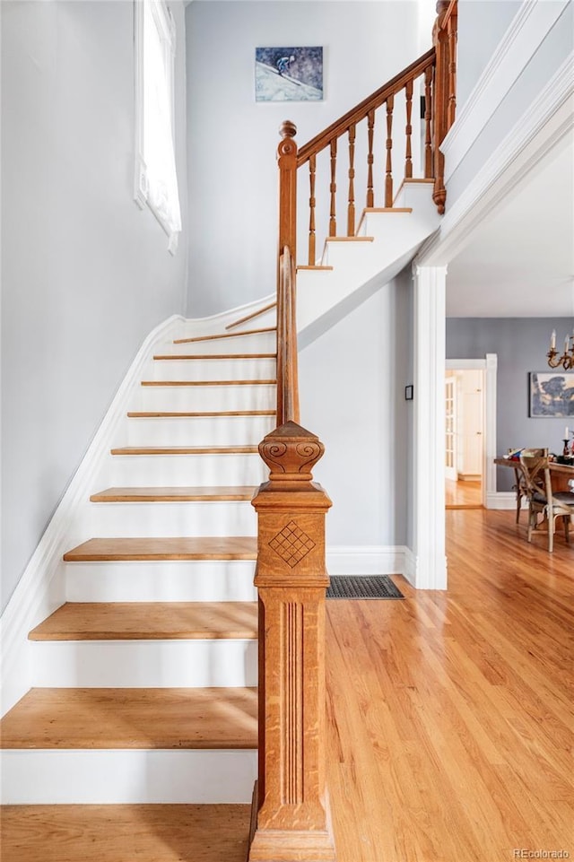 stairs featuring wood-type flooring