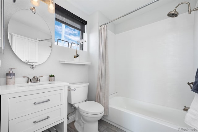 full bath featuring vanity, shower / bath combo with shower curtain, and toilet