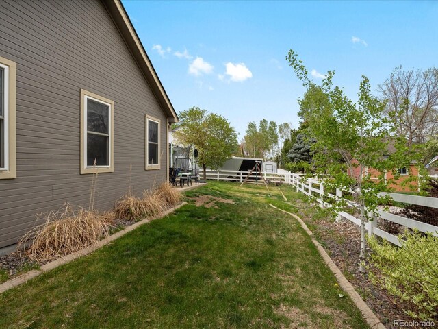 5708 Wetland Loop, Frederick, CO 80504 - view of yard featuring fence and an outdoor structure