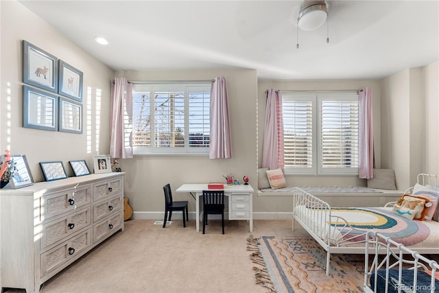 office featuring light carpet and ceiling fan