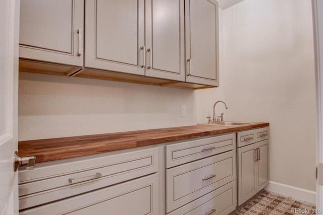 interior space with wooden counters and sink