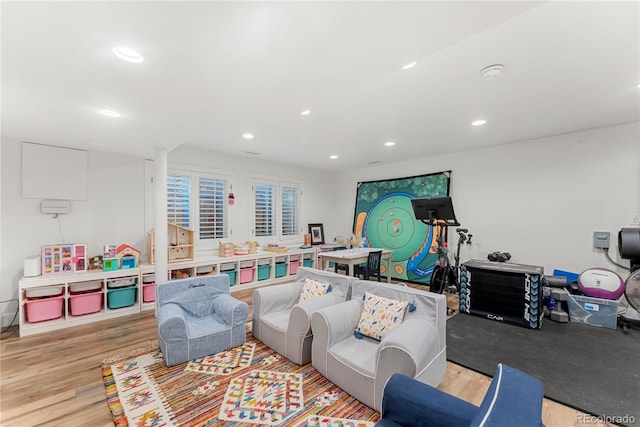 playroom with light hardwood / wood-style flooring