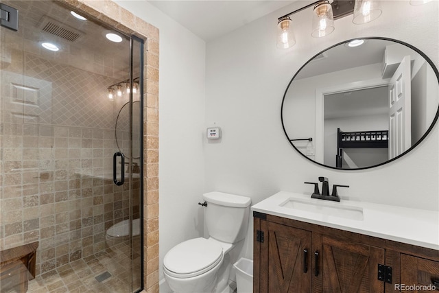 bathroom featuring toilet, walk in shower, and vanity