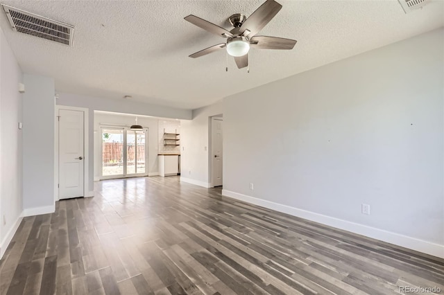4932 Jasper St, Denver, CO 80239 - unfurnished living room with ceiling fan, a textured ceiling, and wood finished floors