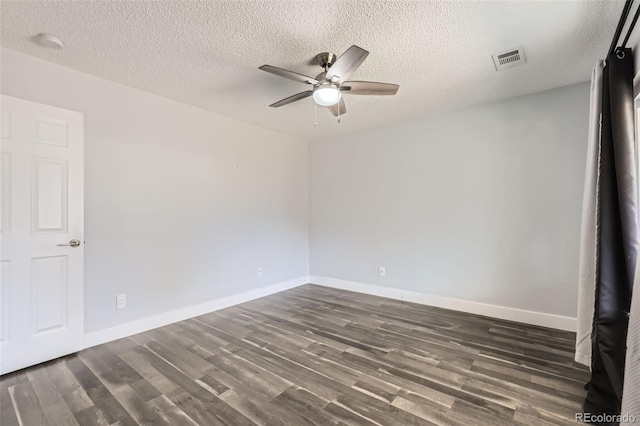 4932 Jasper St, Denver, CO 80239 - spare room featuring a ceiling fan, dark wood-style floors, a textured ceiling, and a smoke detector