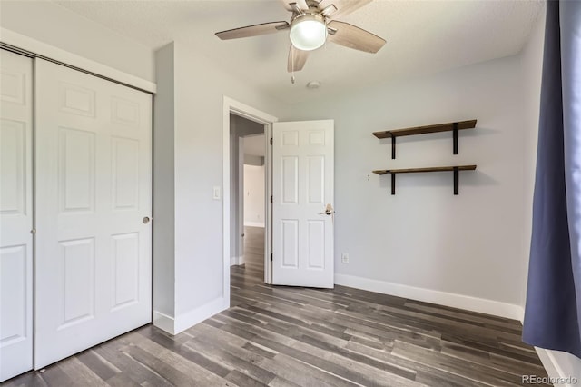 4932 Jasper St, Denver, CO 80239 - unfurnished bedroom featuring wood finished floors, a closet, and a ceiling fan