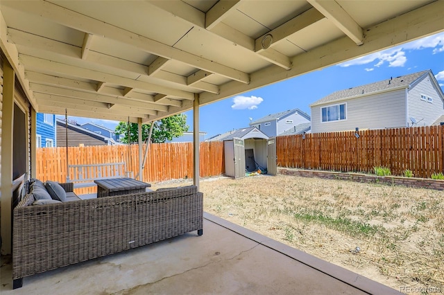 4932 Jasper St, Denver, CO 80239 - fenced backyard with a patio area, a storage unit, outdoor lounge area, and a residential view