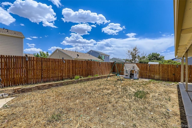 4932 Jasper St, Denver, CO 80239 - fenced backyard with a playground