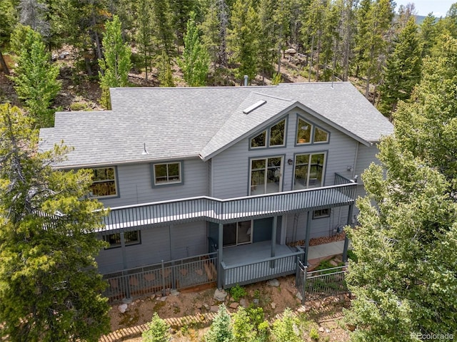 6882 Snowshoe Trl, Evergreen, CO 80439 - back of property with roof with shingles