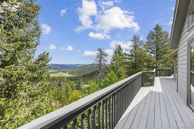 6882 Snowshoe Trl, Evergreen, CO 80439 - wooden terrace with a mountain view