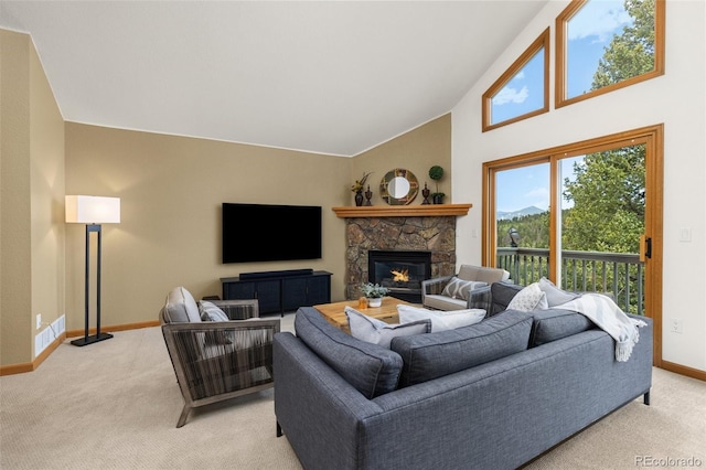 6882 Snowshoe Trl, Evergreen, CO 80439 - living room with light carpet, a fireplace, and high vaulted ceiling