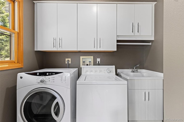 6882 Snowshoe Trl, Evergreen, CO 80439 - washroom featuring washer and clothes dryer and cabinet space