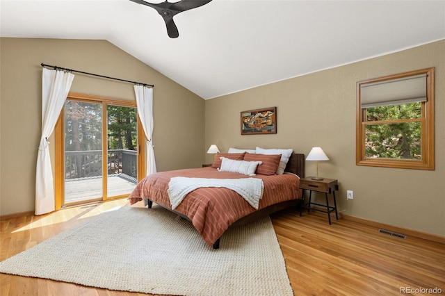 6882 Snowshoe Trl, Evergreen, CO 80439 - bedroom with access to exterior, wood finished floors, vaulted ceiling, and ceiling fan