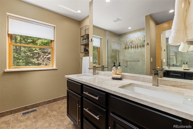 6882 Snowshoe Trl, Evergreen, CO 80439 - bathroom with double vanity, a shower stall, tile patterned floors, and recessed lighting
