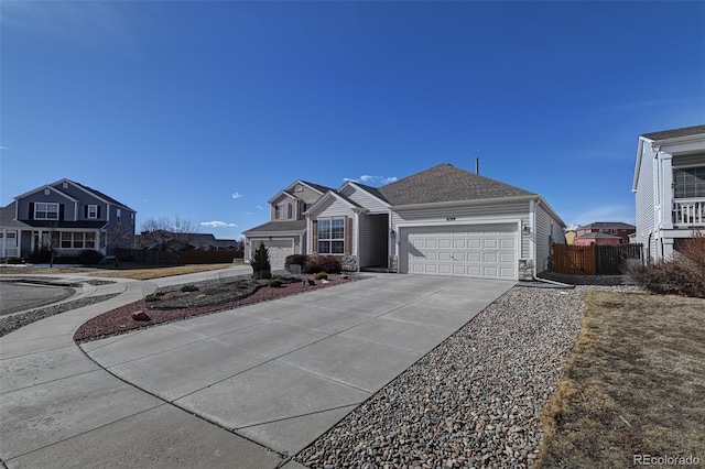 view of front of property featuring a garage, driveway, a shingled roof, and fence