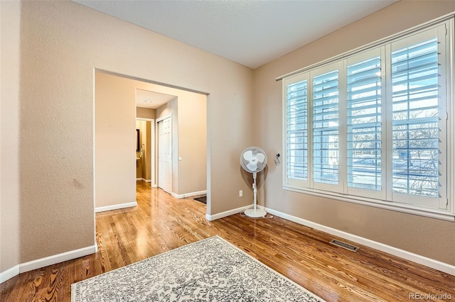 spare room featuring light hardwood / wood-style flooring