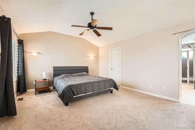 carpeted bedroom with ceiling fan and lofted ceiling