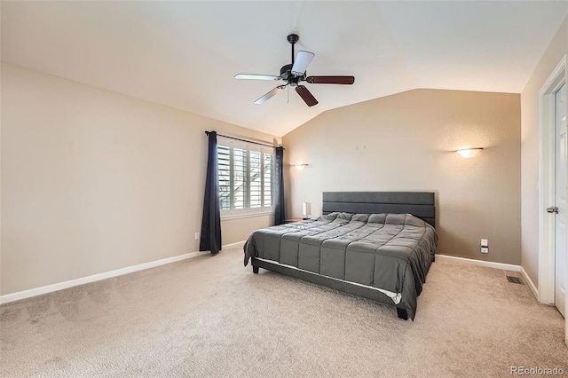 carpeted bedroom featuring vaulted ceiling and ceiling fan