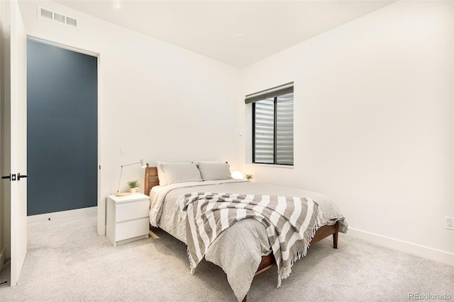 1983 S Logan St, Denver, CO 80210 - bedroom with baseboards, light colored carpet, and visible vents