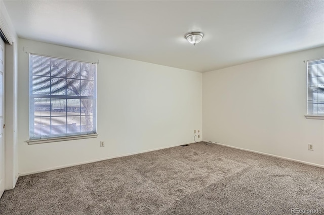 empty room featuring carpet flooring