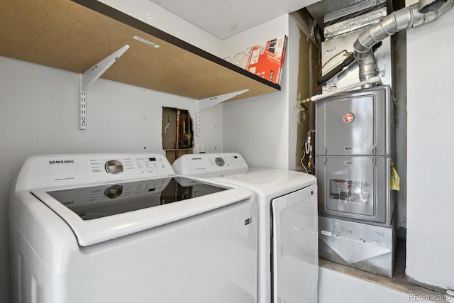 washroom with washing machine and clothes dryer