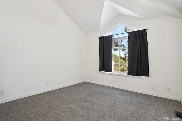additional living space with lofted ceiling, dark colored carpet, and baseboards