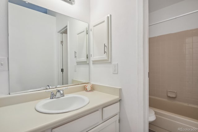 full bathroom featuring toilet and vanity