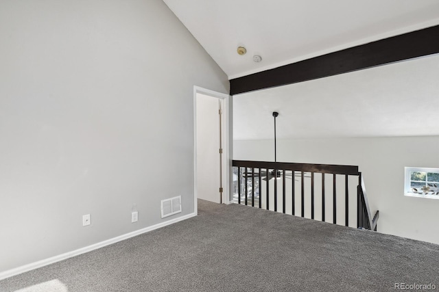 unfurnished room with lofted ceiling and carpet floors