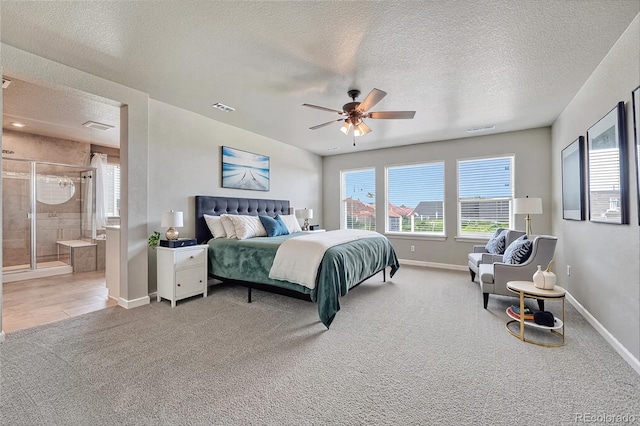 23957 E Rocky Top Ave, Aurora, CO 80016 - bedroom featuring light colored carpet, a textured ceiling, baseboards, ceiling fan, and ensuite bathroom