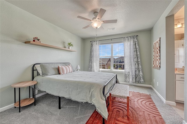 23957 E Rocky Top Ave, Aurora, CO 80016 - bedroom featuring light colored carpet, a textured ceiling, baseboards, and a ceiling fan