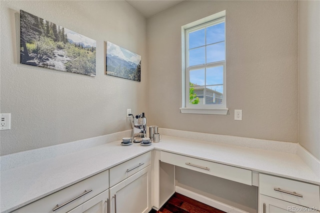 23957 E Rocky Top Ave, Aurora, CO 80016 - unfurnished office featuring built in desk and dark wood-style flooring