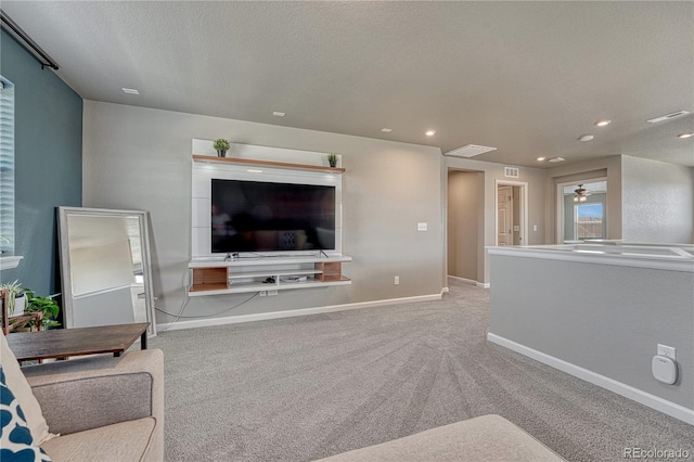23957 E Rocky Top Ave, Aurora, CO 80016 - carpeted living area featuring ceiling fan, recessed lighting, and a textured ceiling