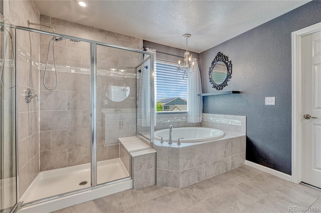 23957 E Rocky Top Ave, Aurora, CO 80016 - bathroom featuring a textured wall, a bath, a shower stall, tile patterned floors, and a textured ceiling