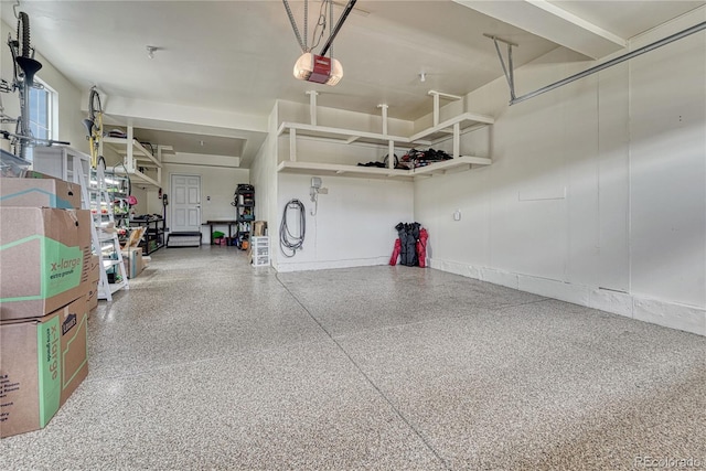 23957 E Rocky Top Ave, Aurora, CO 80016 - garage featuring a garage door opener and baseboards