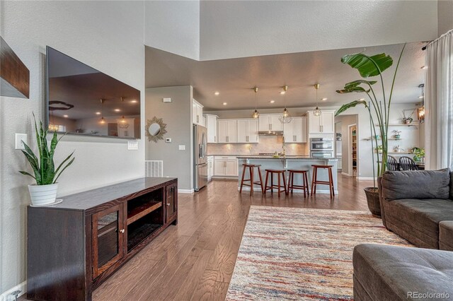 23957 E Rocky Top Ave, Aurora, CO 80016 - living area featuring wood finished floors and recessed lighting
