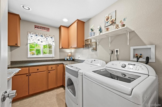 12625 W 66th Cir, Arvada, CO 80004 - laundry room with washer and clothes dryer, cabinet space, light tile patterned floors, a textured wall, and recessed lighting